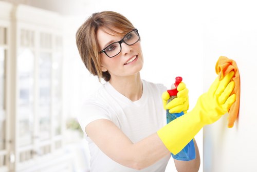 Technician performing carpet cleaning in West Heath with extraction equipment